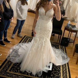 This dress has never been wore. Slightly altered but can be reversed. Style 6793